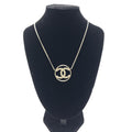 Collana con pendente tondo a doppia C color oro Chanel
