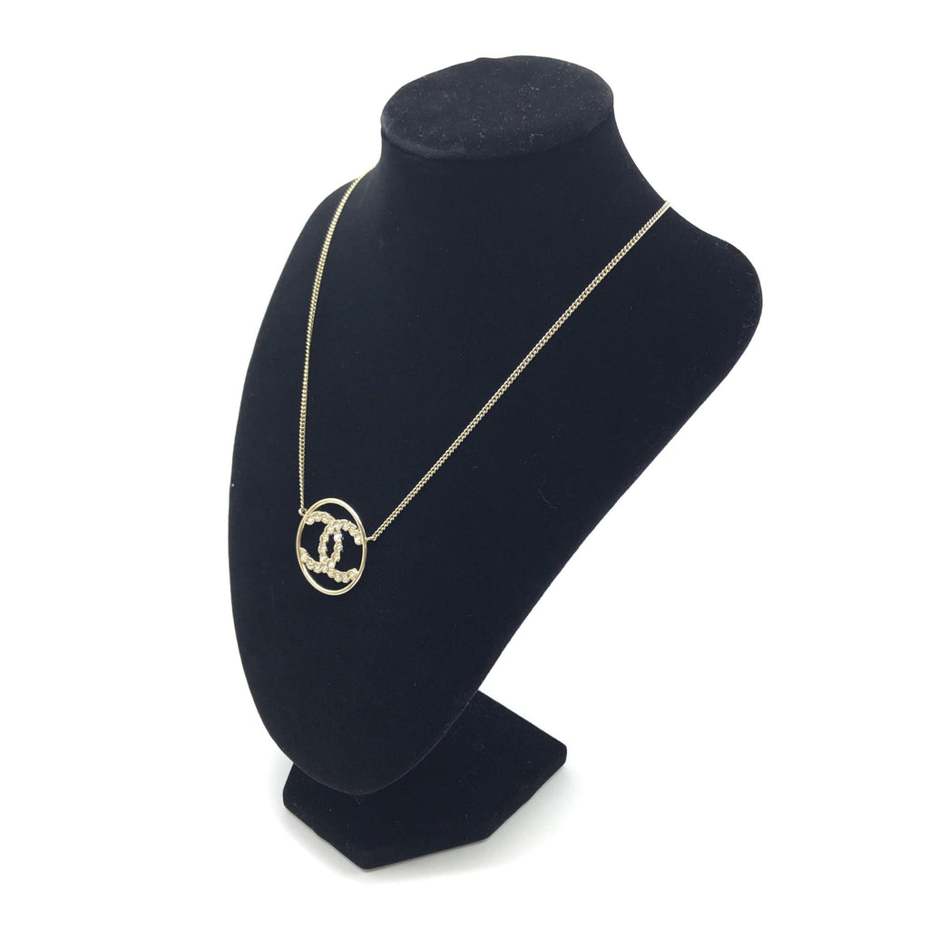 Collana con pendente tondo a doppia C color oro Chanel