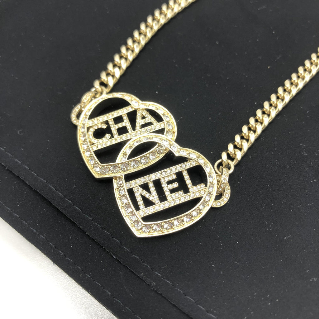 Collana Choker Chanel color oro a cuore con logo