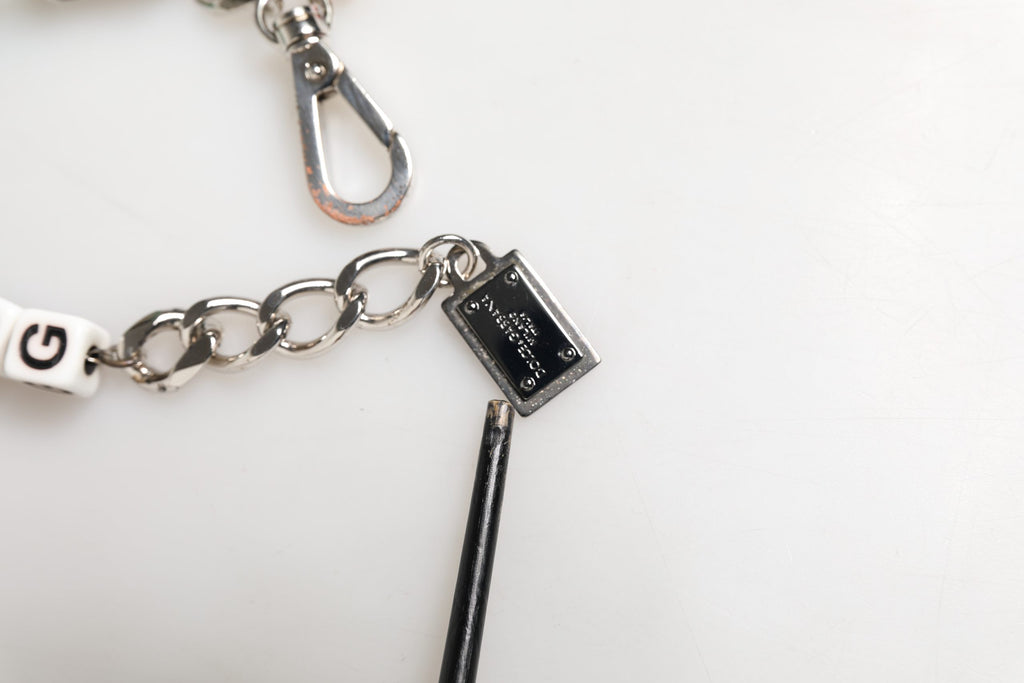 Bracciale con charm Dolce & Gabbana in ottone argentato a catena con dadi e logo DG