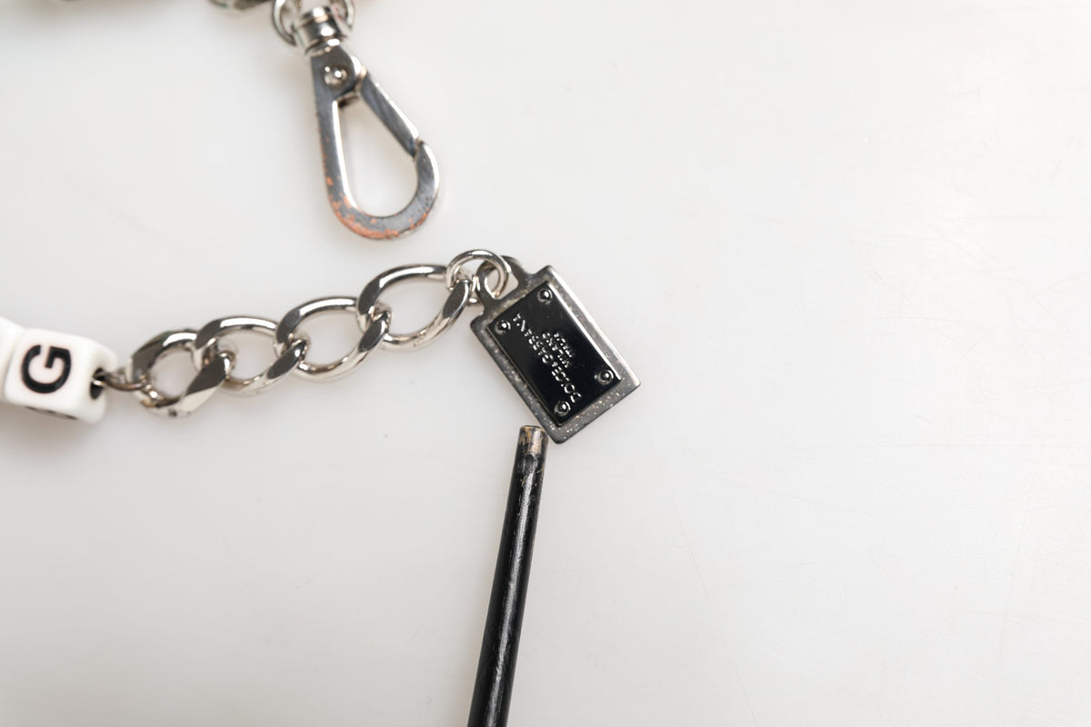 Bracciale con charm Dolce & Gabbana in ottone argentato a catena con dadi e logo DG