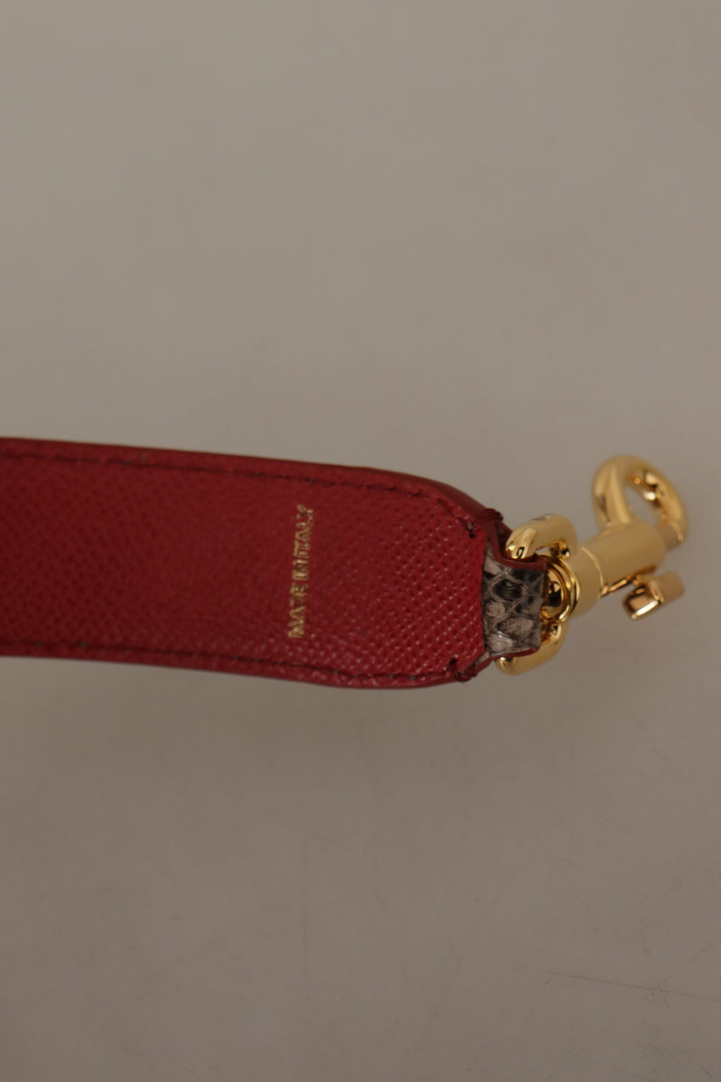 Tracolla borchiata Dolce & Gabbana in pelle di pitone marrone