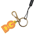 Portachiavi in metallo in ottone dorato con logo DG in gomma gialla Dolce & Gabbana