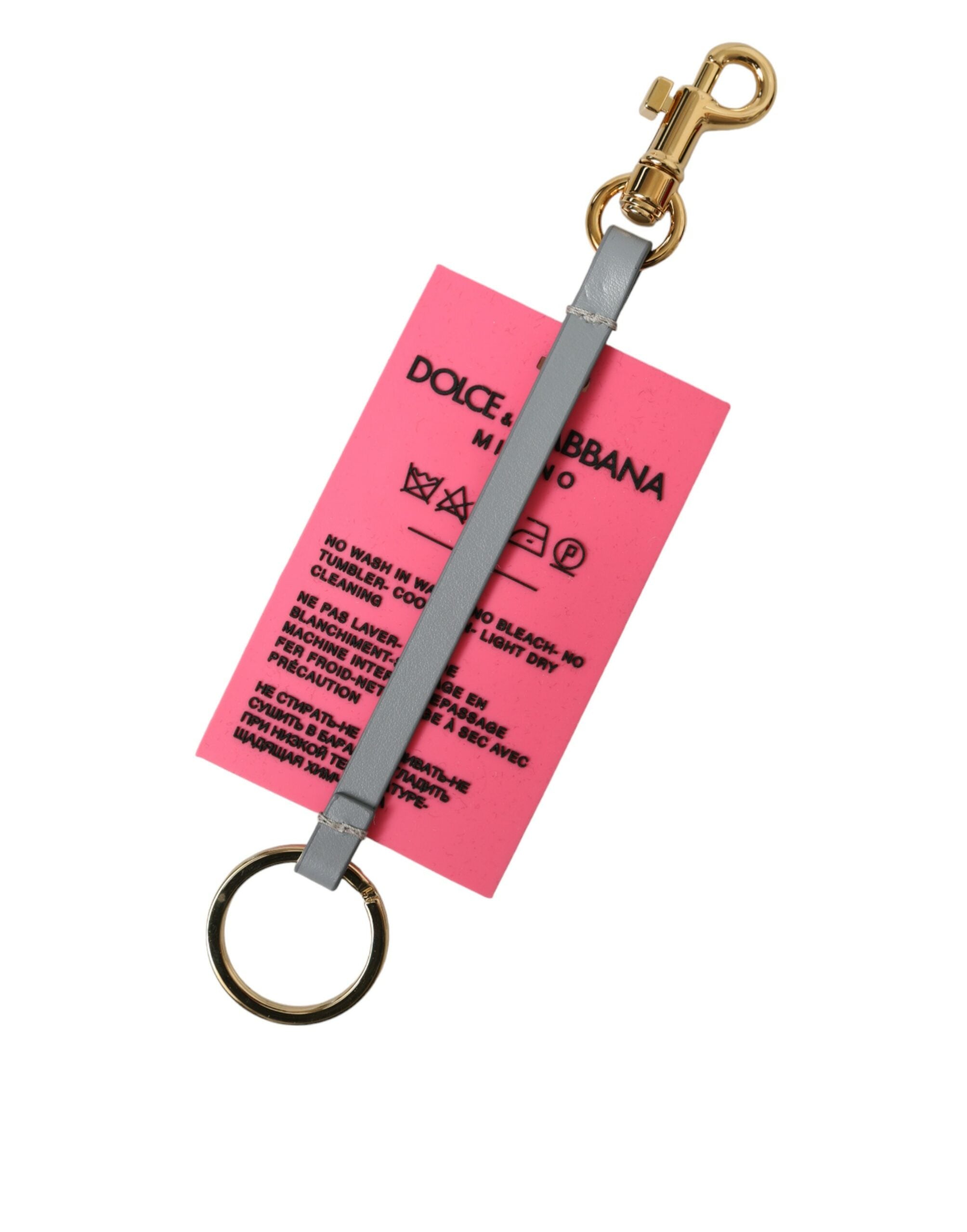 Portachiavi Dolce & Gabbana in silicone rosa con logo DG in ottone dorato
