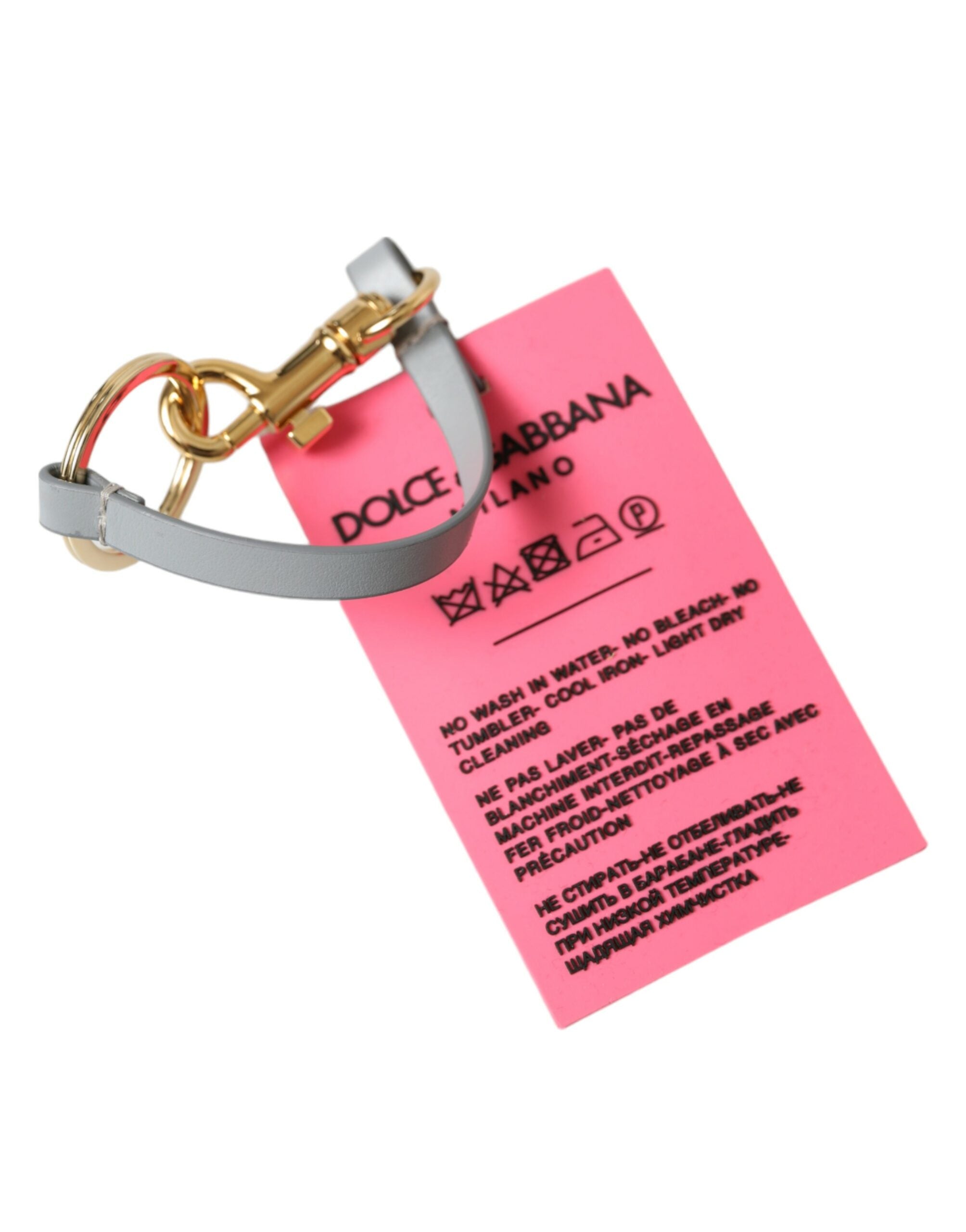 Portachiavi Dolce & Gabbana in silicone rosa con logo DG in ottone dorato
