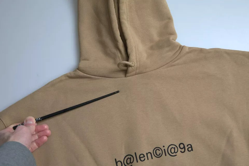 Felpa con cappuccio Balenciaga in mollettone riccio simbolico di cotone marrone