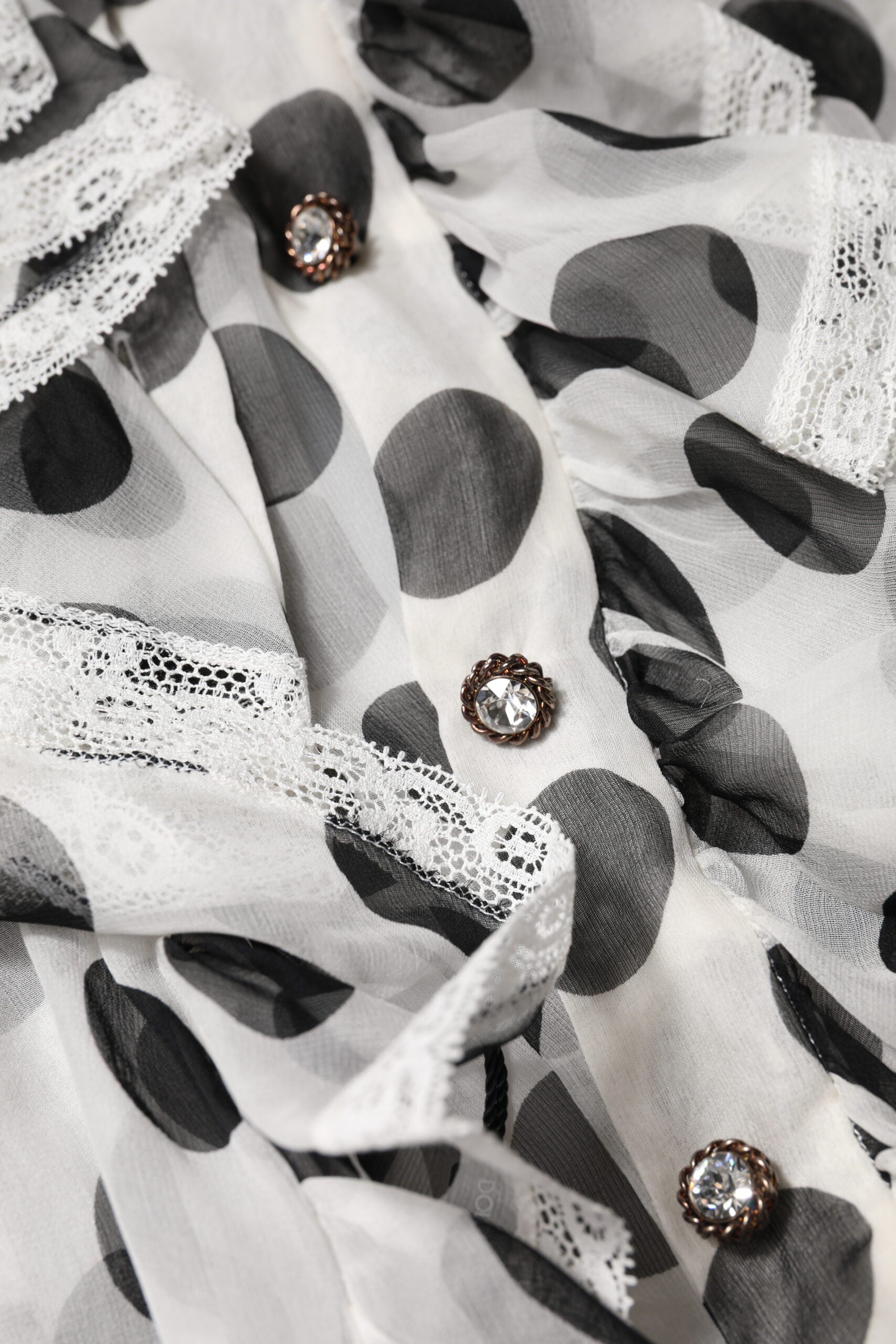 Top smanicato Dolce & Gabbana in cotone bianco a pois neri