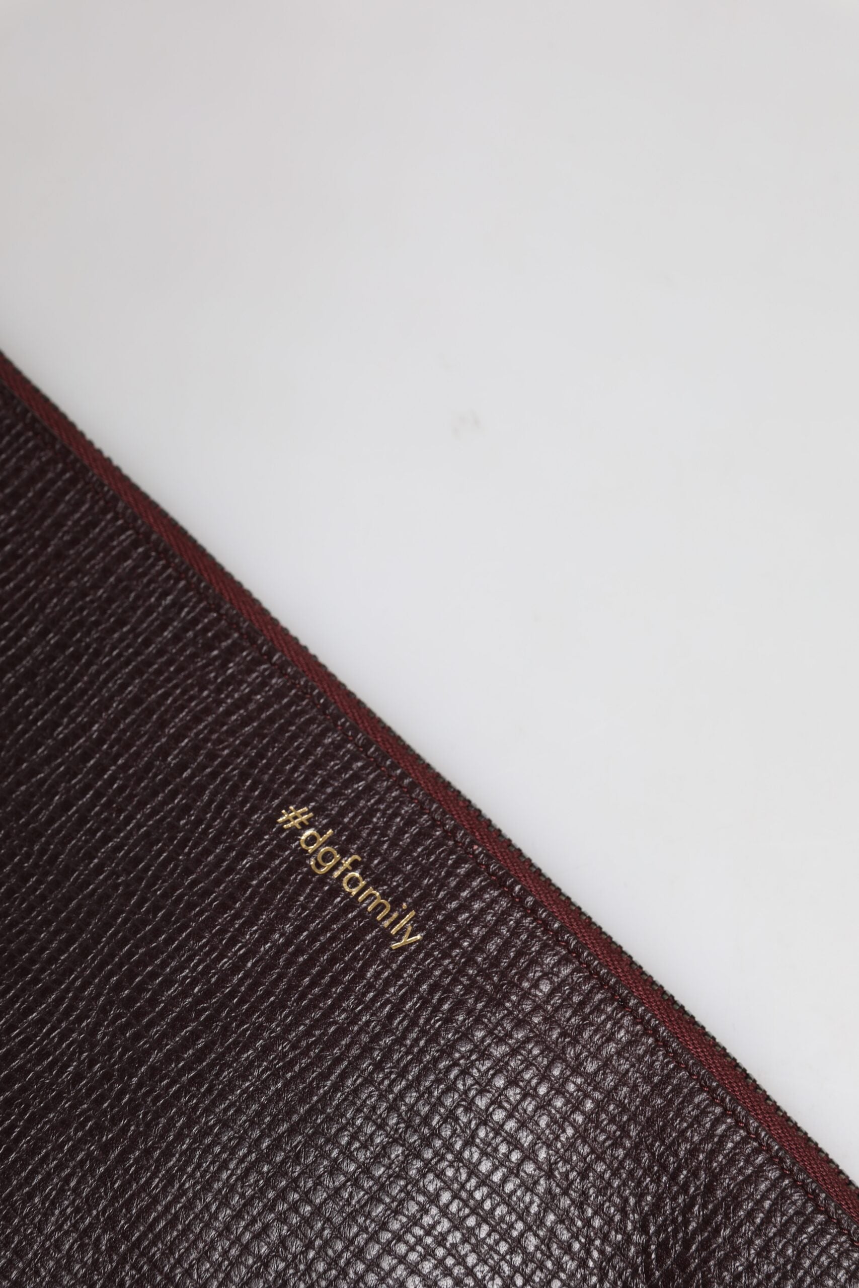 Pochette da uomo Dolce & Gabbana in pelle marrone con applicazioni #DGFAMILY