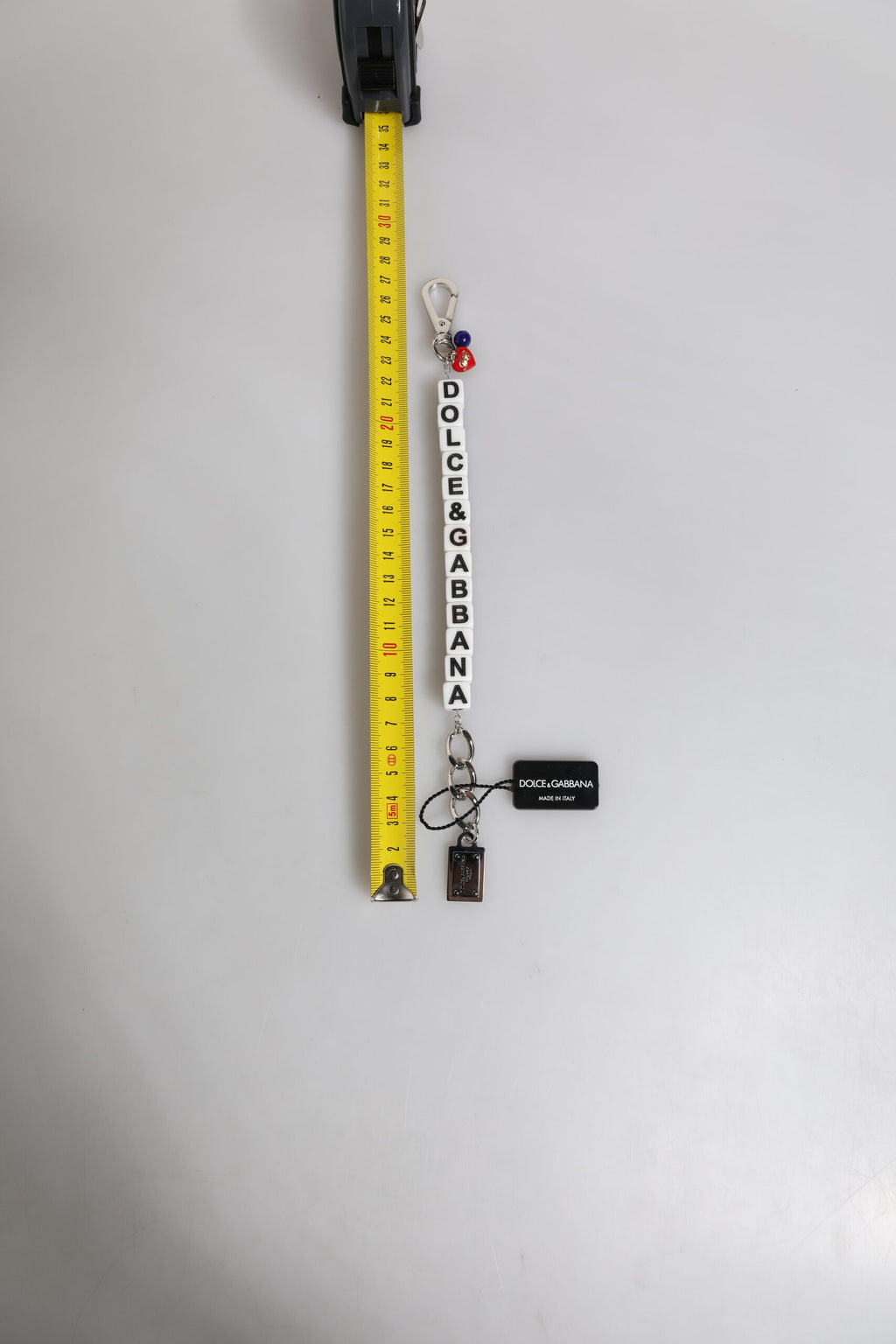 Bracciale Dolce & Gabbana con ciondolo a forma di dado in ottone color argento e logo