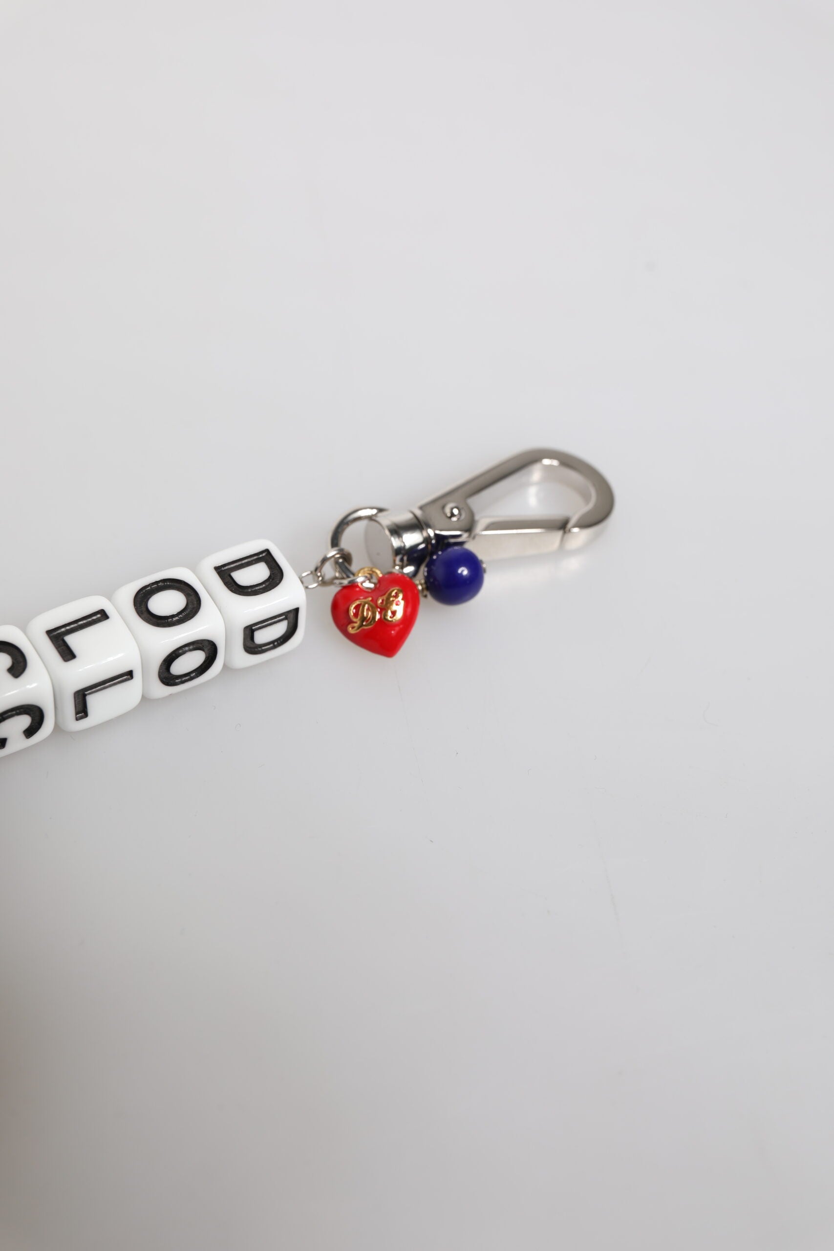 Bracciale Dolce & Gabbana con ciondolo a forma di dado in ottone color argento e logo