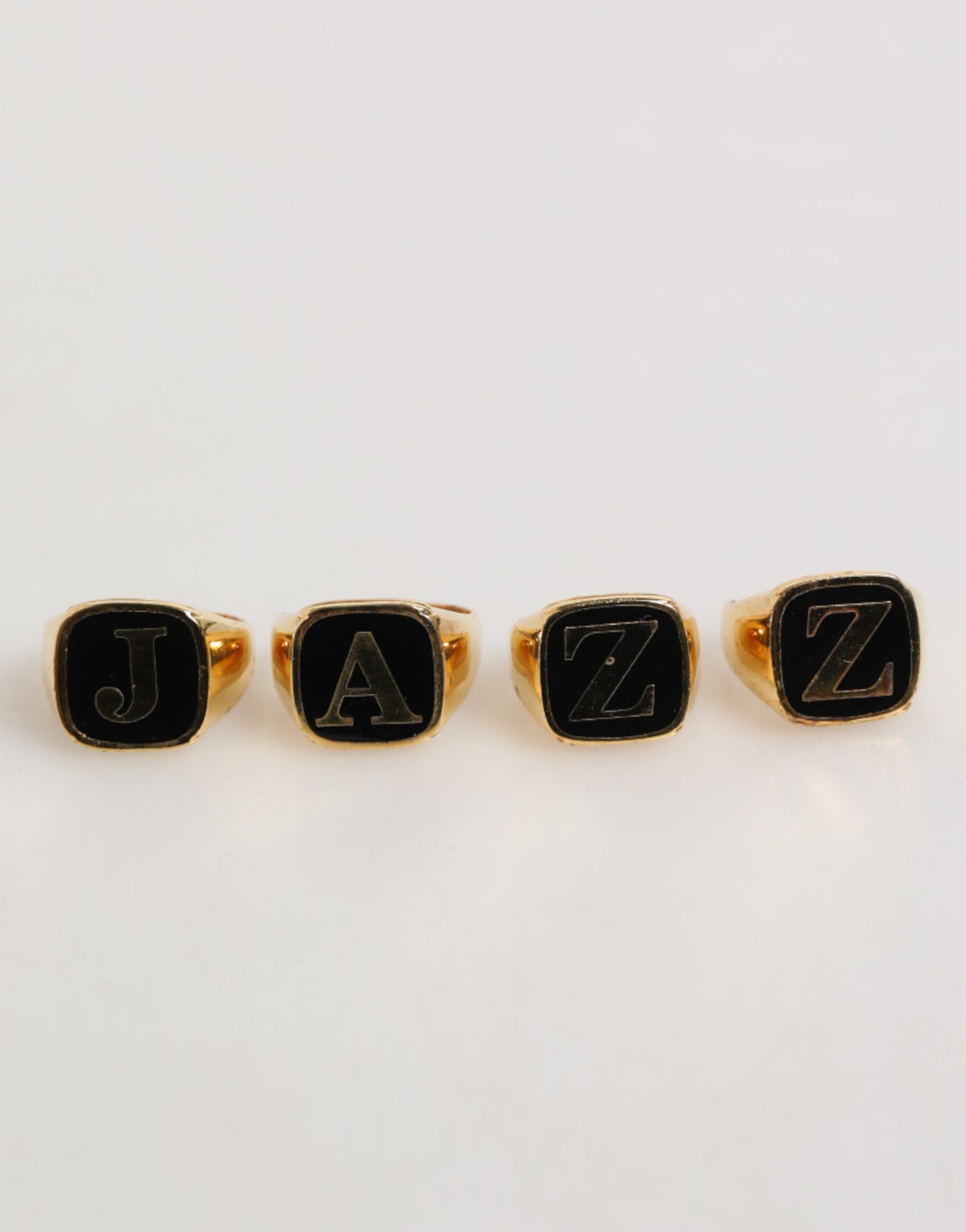 Dolce & Gabbana Anello regolabile, set di 4 pezzi con lettere "JAZZ" in ottone color oro