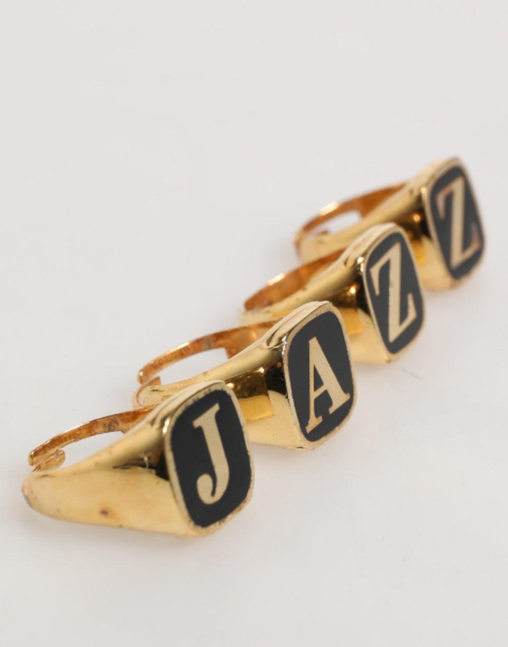 Dolce & Gabbana Anello regolabile, set di 4 pezzi con lettere "JAZZ" in ottone color oro