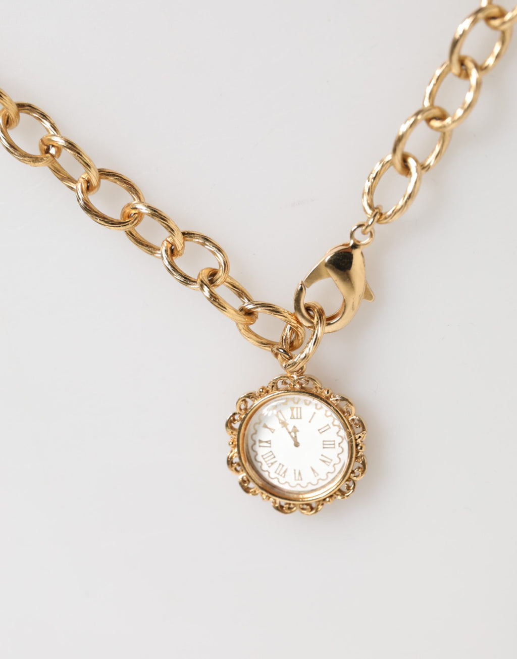 Collana girocollo Dolce & Gabbana con ciondolo a orologio in cristallo dorato