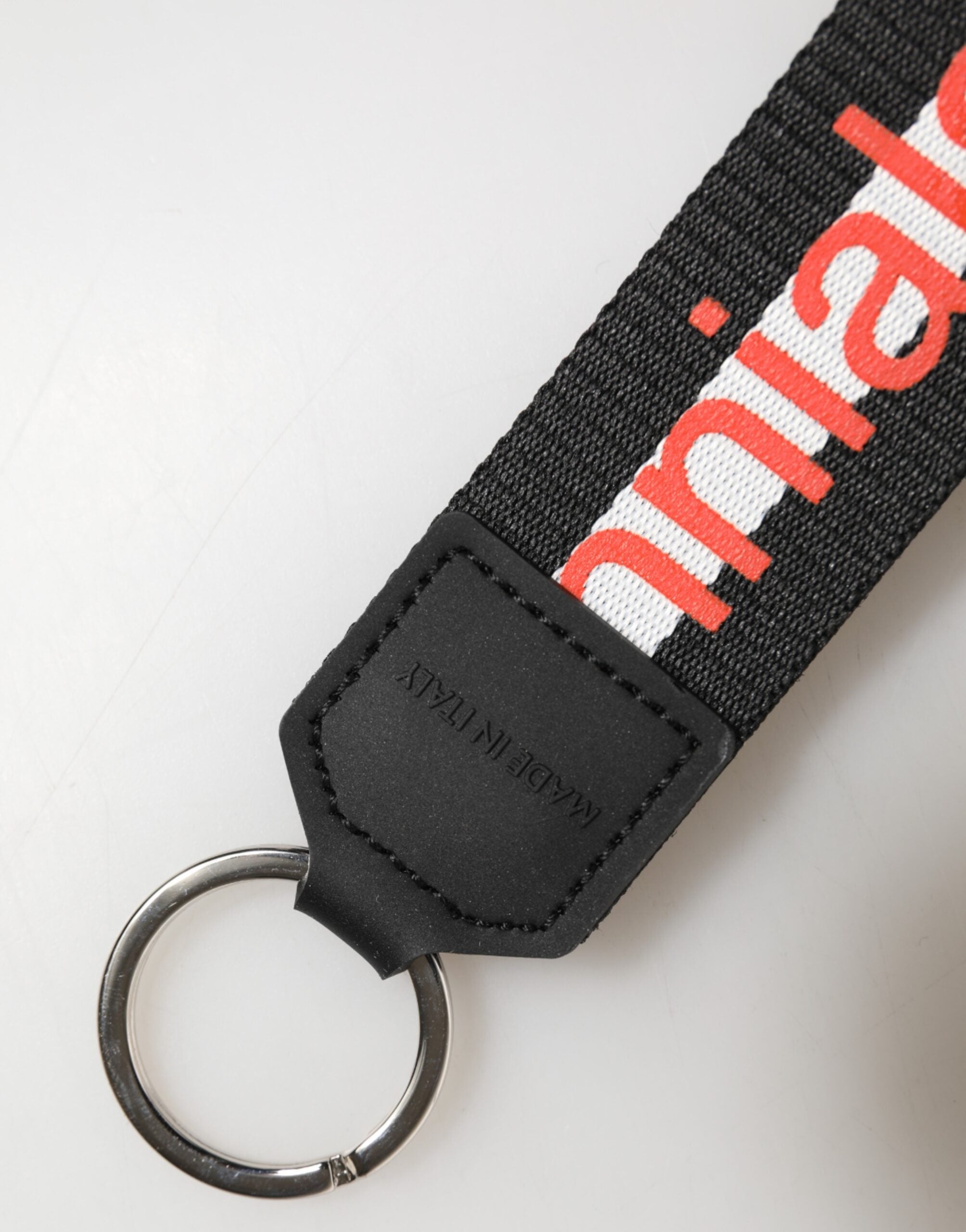 Portachiavi Dolce & Gabbana nero in poliestere con logo e supporto in ottone argentato